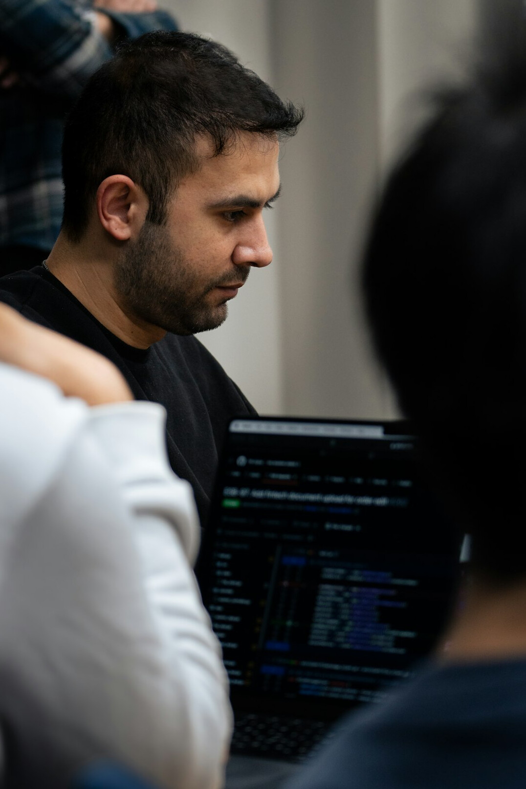 team discussing code in office